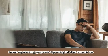 Person experiencing symptoms of greening out after cannabis use